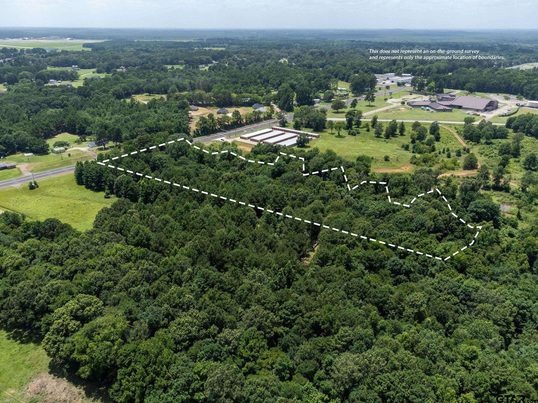 149 St Longview Tx 75603 Longview, TX 75601 - Photo 4 of 12 a view of a city with lush green forest