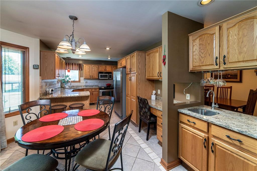 170 McDermott Road Trafford, PA 15085 - Photo 5 of 25 Beautiful kitchen with S/S appliances and granite counter top. Pass through serving/bar area open to the dining room.