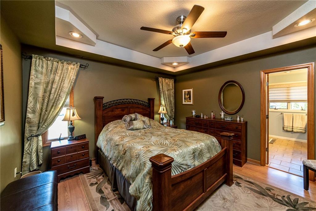 170 McDermott Road Trafford, PA 15085 - Photo 10 of 25 Owners suite with custom double tray ceiling ,engineered hardwood floors. Custom bathroom.
