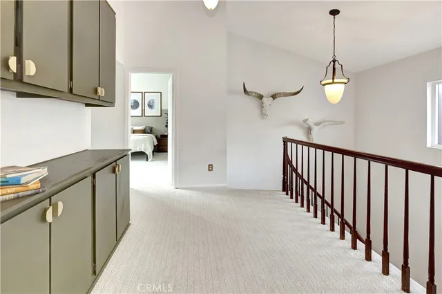 a view of a kitchen and an empty room