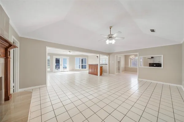 a view of livingroom with furniture chandelier fan and fire place