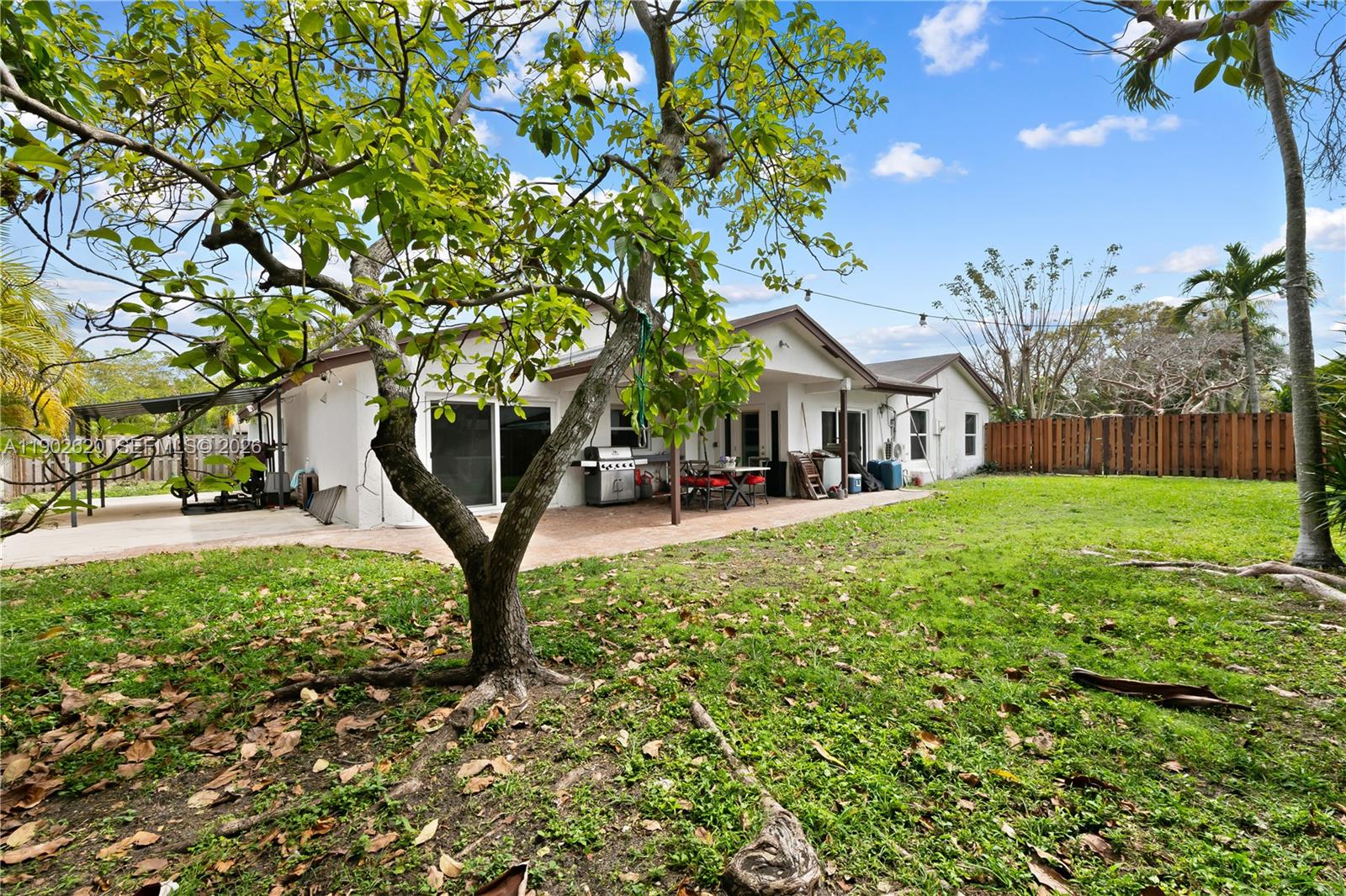 10610 Southwest 128th Avenue Miami, FL 33186 - Photo 15 of 46 a view of a house with a yard