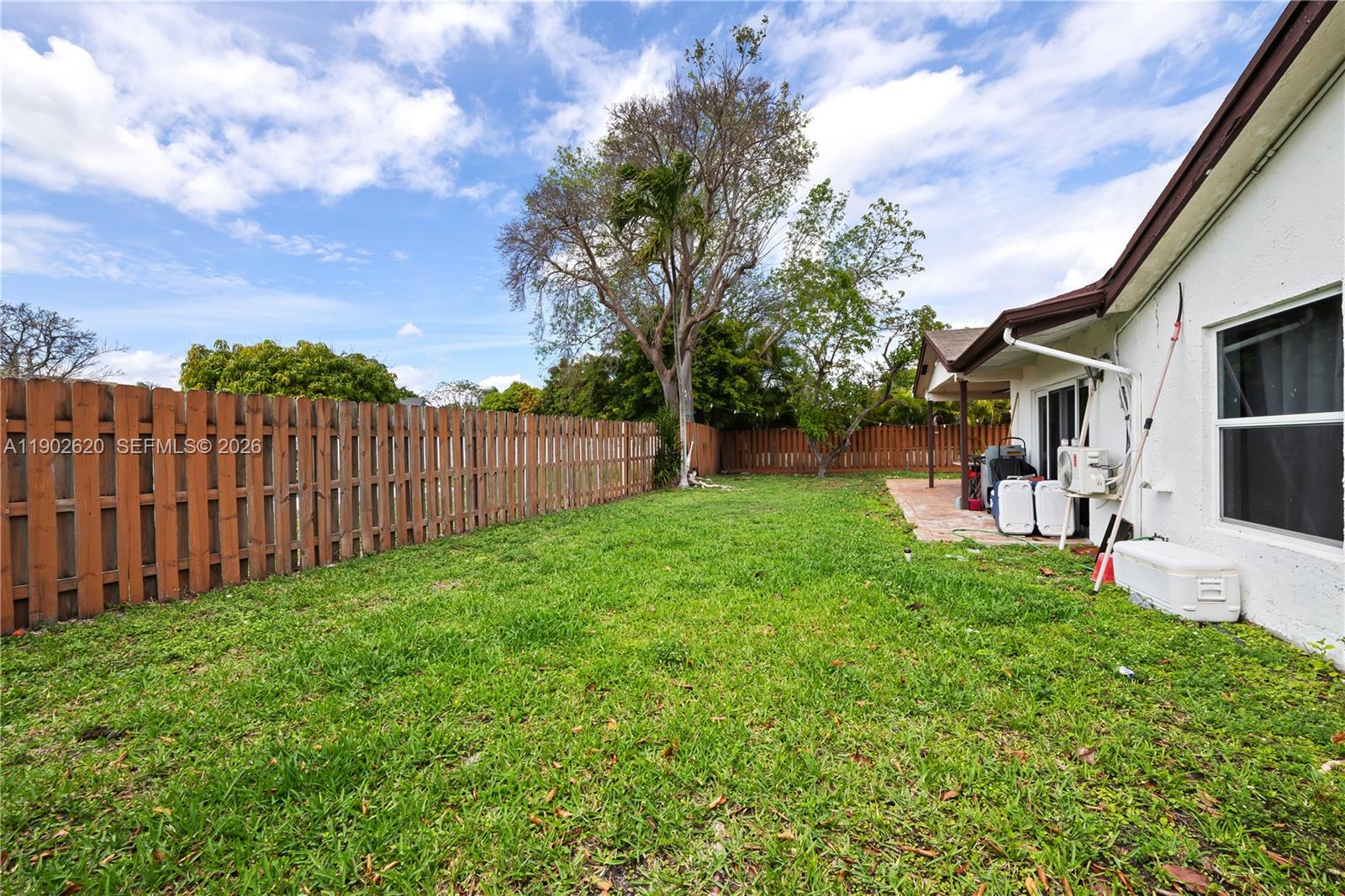 10610 Southwest 128th Avenue Miami, FL 33186 - Photo 17 of 46 a view of a backyard with a garden