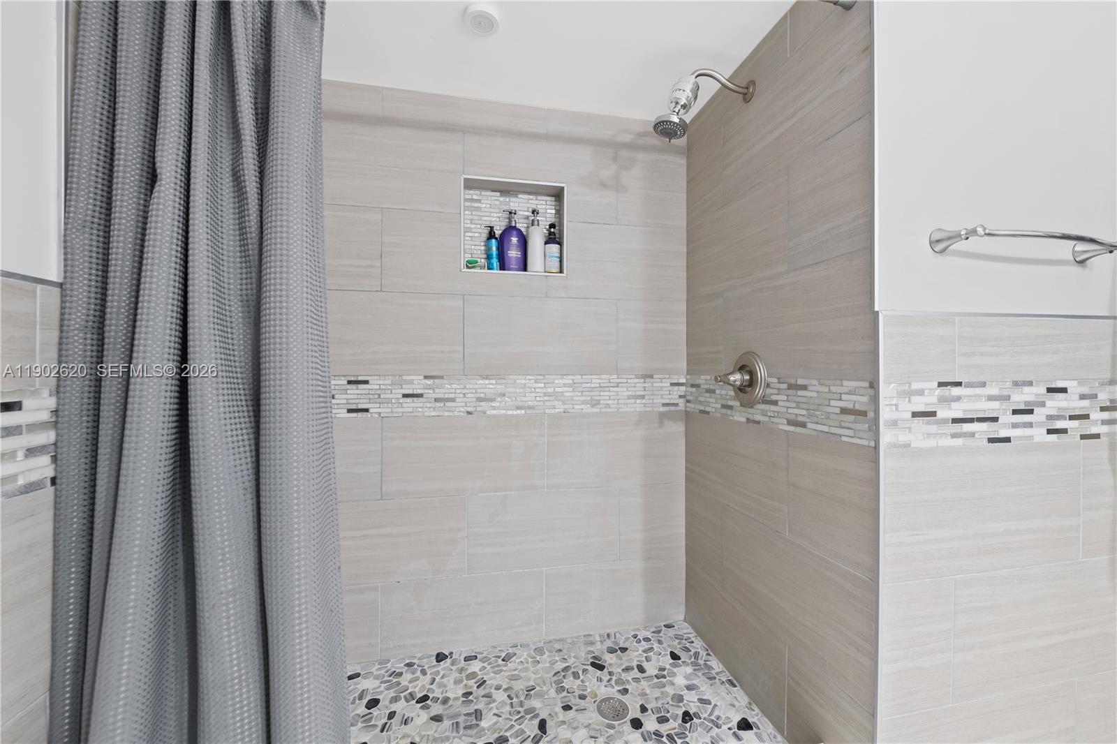 10610 Southwest 128th Avenue Miami, FL 33186 - Photo 19 of 46 a bathroom with a shower