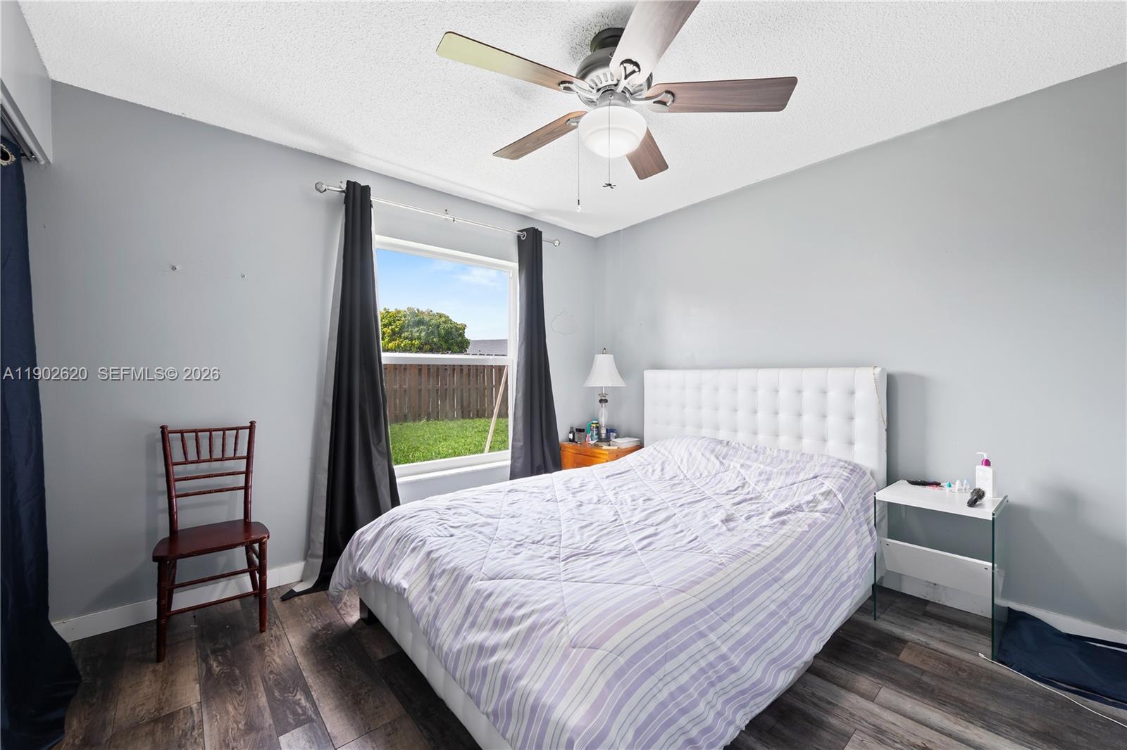 10610 Southwest 128th Avenue Miami, FL 33186 - Photo 20 of 46 a bedroom with a bed and a window