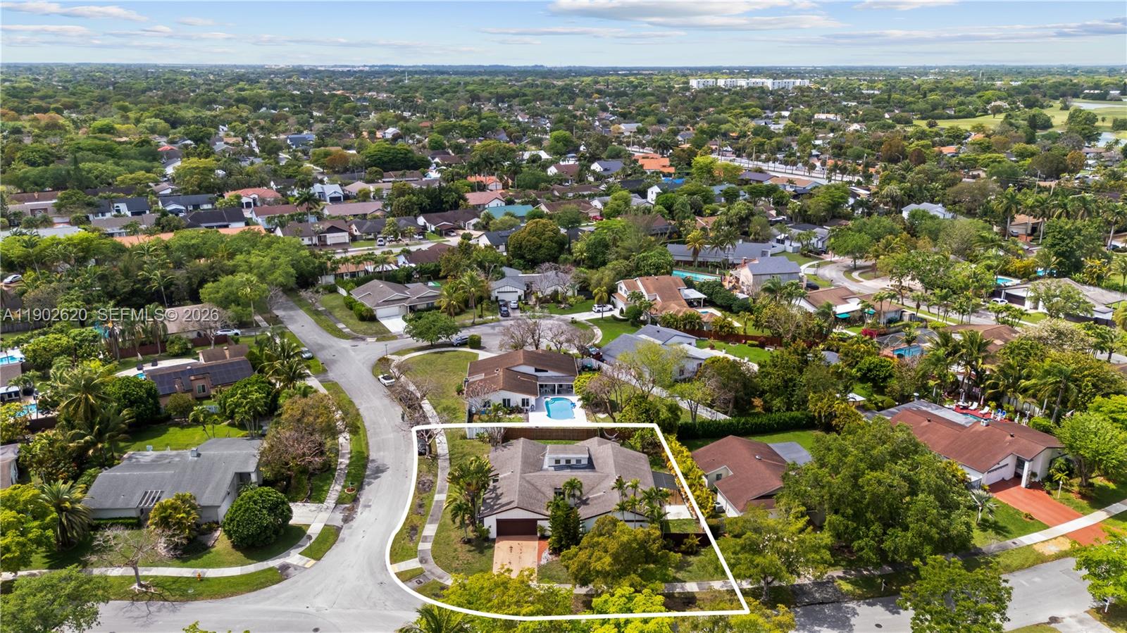 10610 Southwest 128th Avenue Miami, FL 33186 - Photo 2 of 46 an aerial view of a residential houses with outdoor space and trees