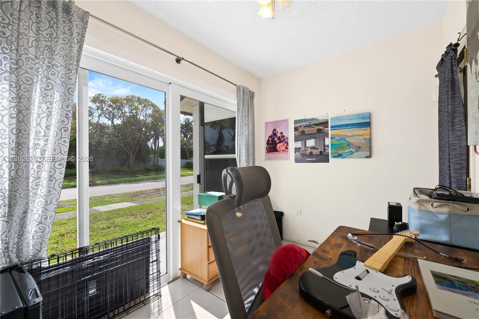 10610 Southwest 128th Avenue Miami, FL 33186 - Photo 23 of 46 a room with furniture and a window
