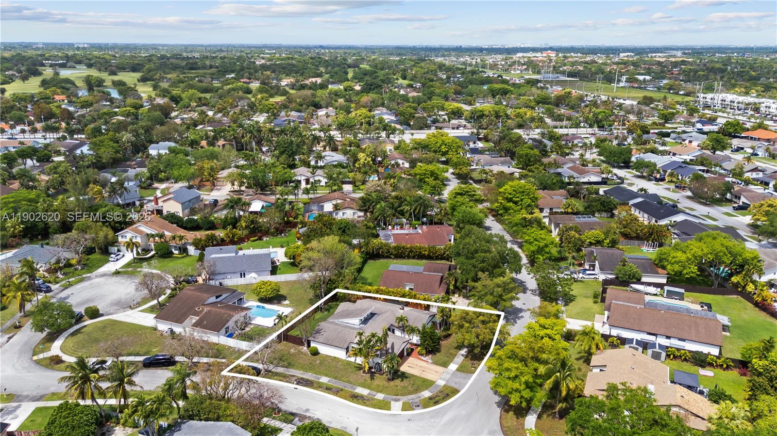 10610 Southwest 128th Avenue Miami, FL 33186 - Photo 3 of 46 an aerial view of residential houses with outdoor space and trees