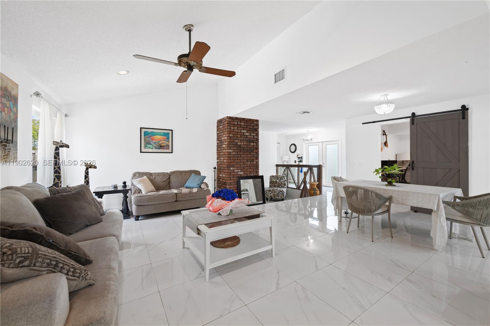 10610 Southwest 128th Avenue Miami, FL 33186 - Photo 34 of 46 a living room with furniture and a couch