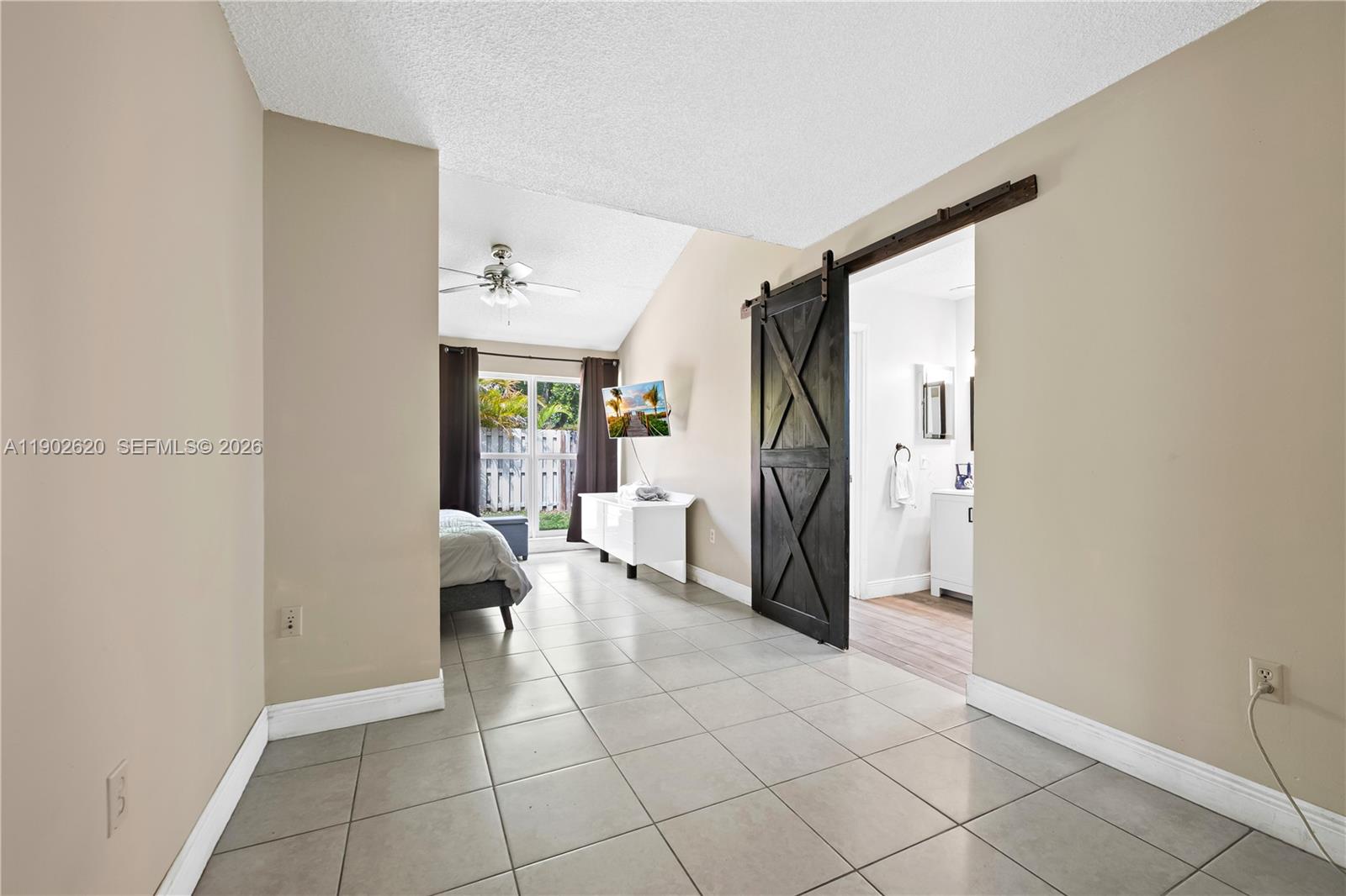 10610 Southwest 128th Avenue Miami, FL 33186 - Photo 44 of 46 a view of a hallway to closet and a livingroom with furniture