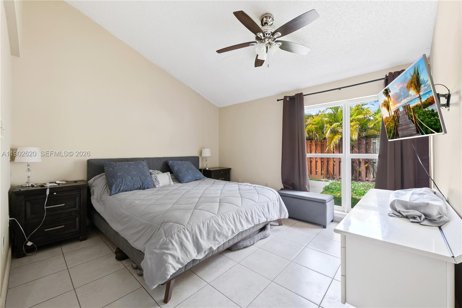 10610 Southwest 128th Avenue Miami, FL 33186 - Photo 45 of 46 a bedroom with a bed and a large window
