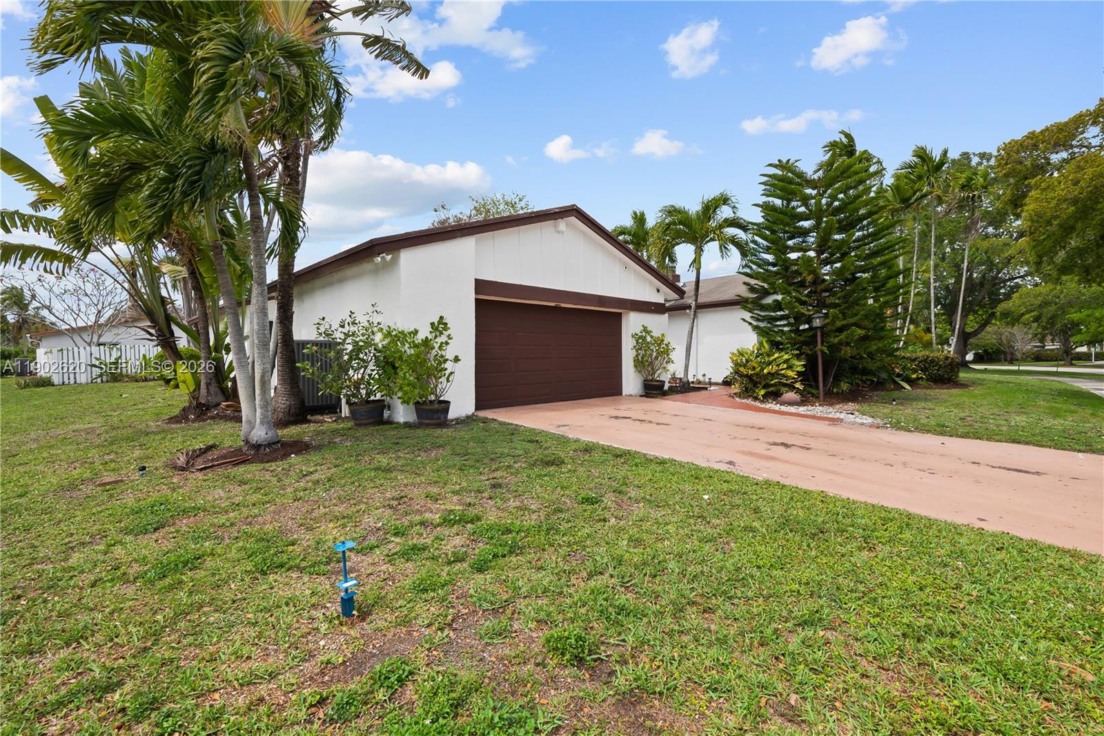 10610 Southwest 128th Avenue Miami, FL 33186 - Photo 6 of 46 a front view of house with yard and green space