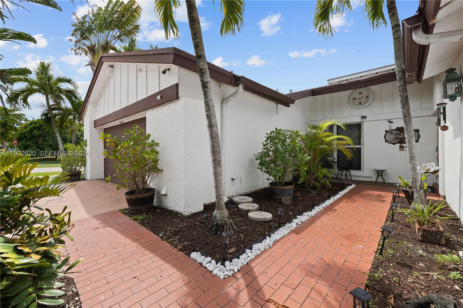 10610 Southwest 128th Avenue Miami, FL 33186 - Photo 8 of 46 a view of a backyard with plants and a patio