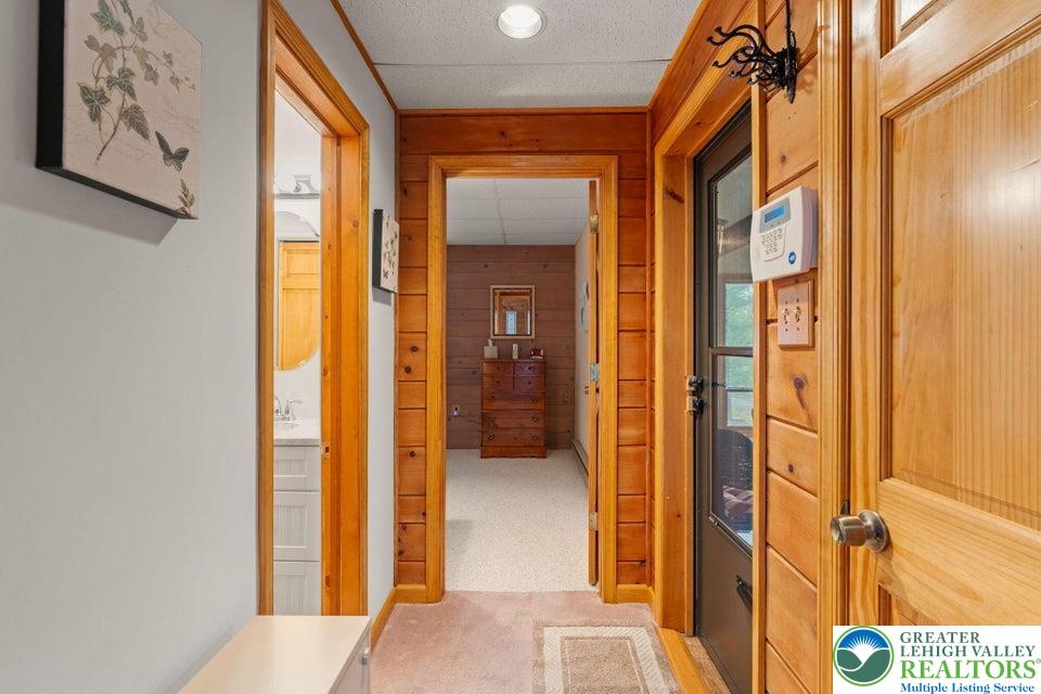 15 Hazard Run Road Lake Harmony, PA 18624 - Photo 17 of 48 a view of a hallway with wooden floor and a bathroom
