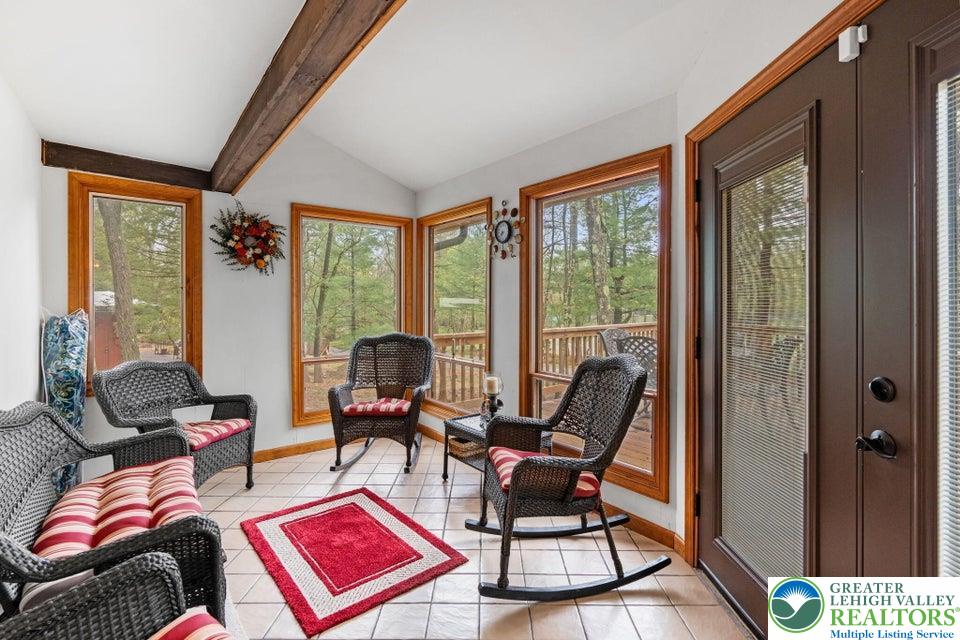 15 Hazard Run Road Lake Harmony, PA 18624 - Photo 19 of 48 a living room with furniture a rug and a large window