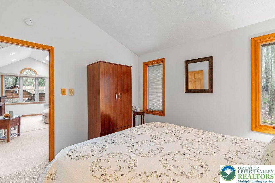 15 Hazard Run Road Lake Harmony, PA 18624 - Photo 23 of 48 a bedroom with a bed and a dresser with rug