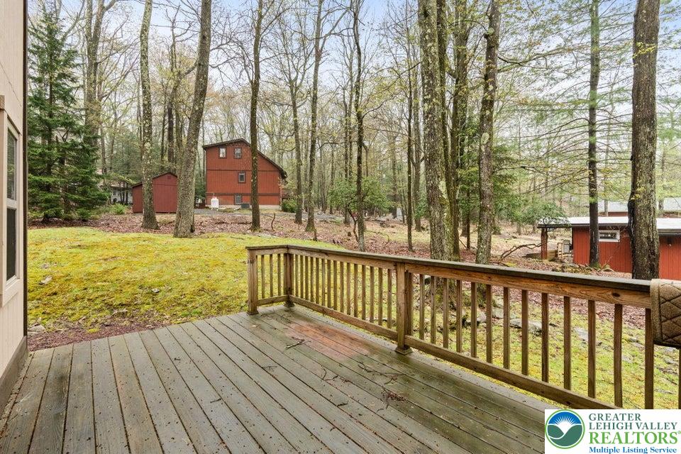15 Hazard Run Road Lake Harmony, PA 18624 - Photo 43 of 48 a view of a balcony with floor to ceiling windows and wooden floor