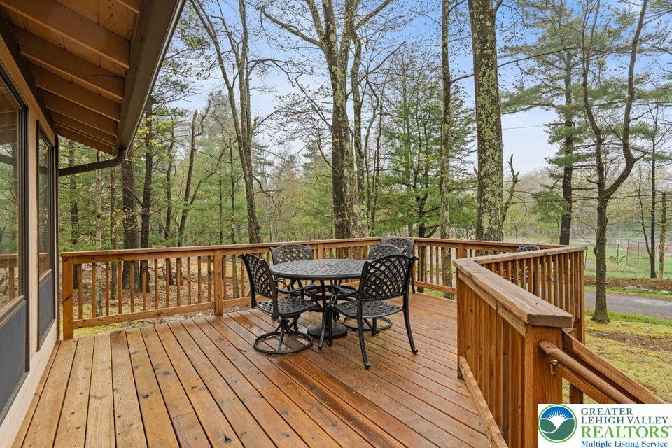 15 Hazard Run Road Lake Harmony, PA 18624 - Photo 44 of 48 a view of a roof deck with table and chairs and wooden floor