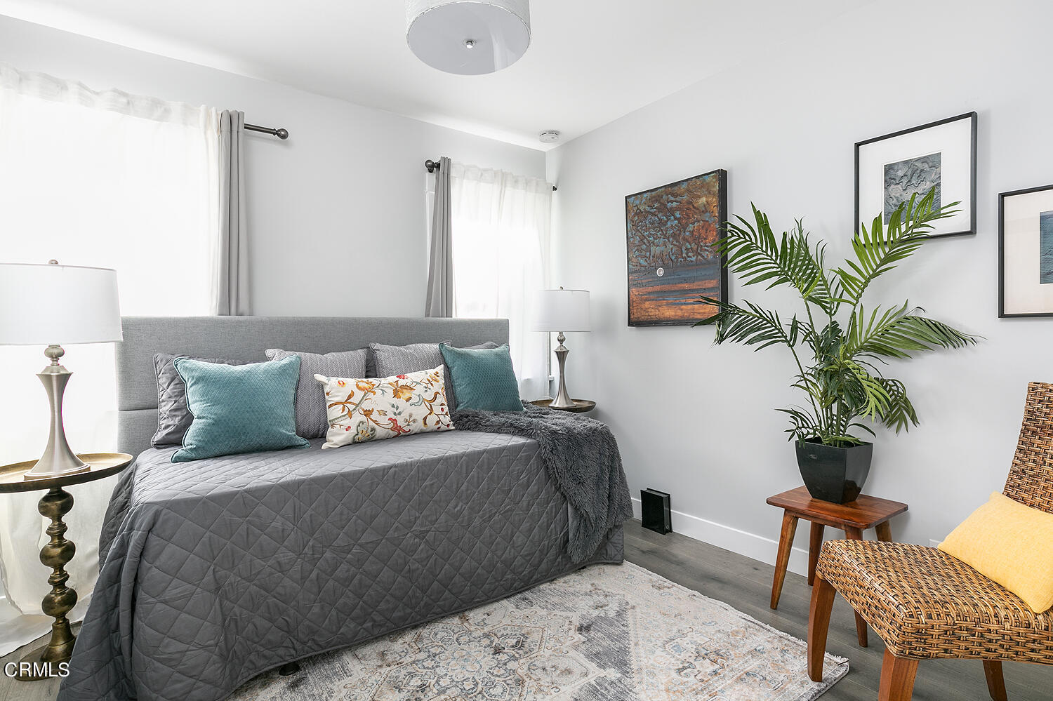 2040 North Madison Avenue Altadena, CA 91001 - Photo 24 of 53 a bedroom with a large bed and a potted plant