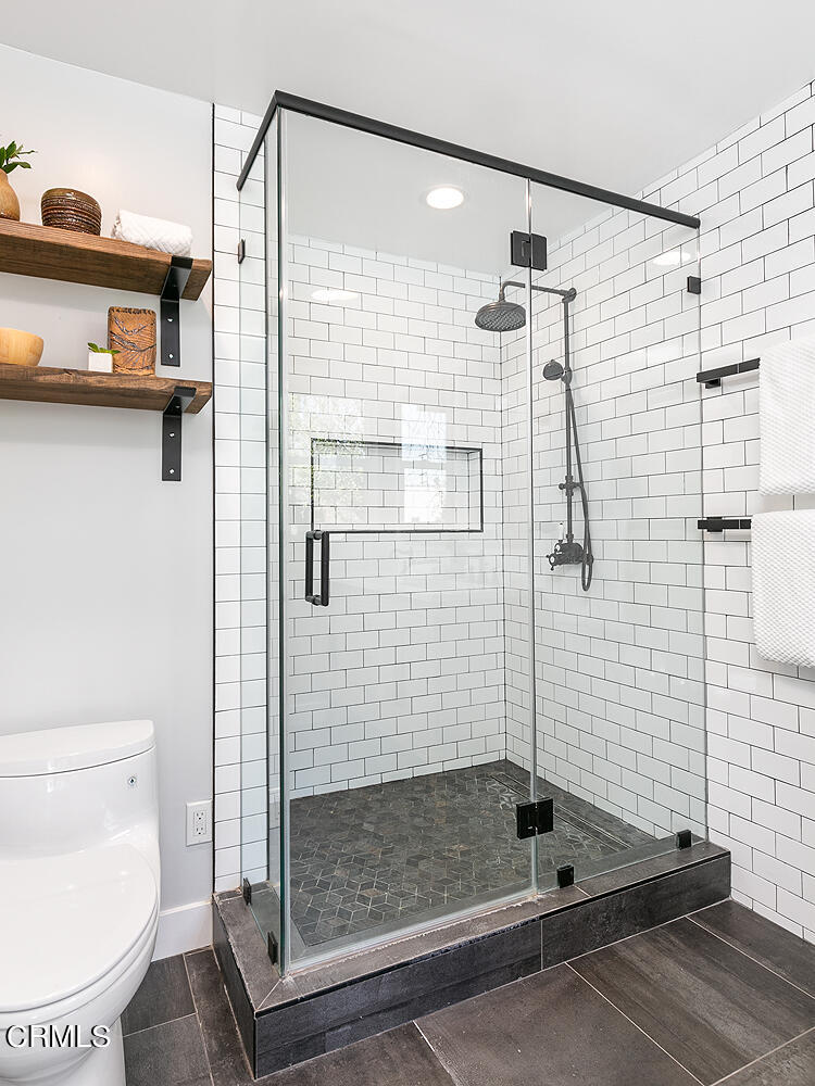 2040 North Madison Avenue Altadena, CA 91001 - Photo 28 of 53 a bathroom with a shower and a toilet