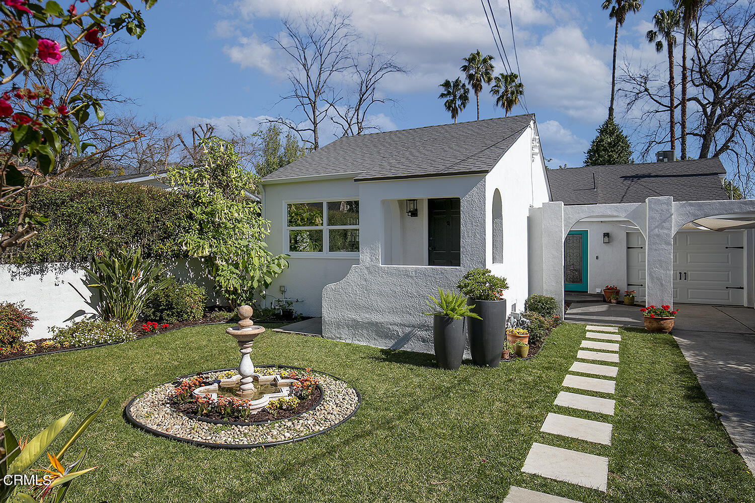 2040 North Madison Avenue Altadena, CA 91001 - Photo 4 of 53 a front view of a house with a garden
