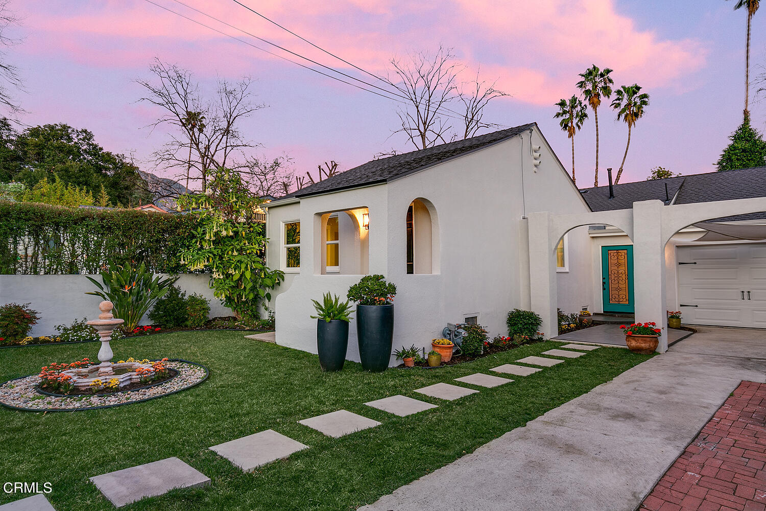 2040 North Madison Avenue Altadena, CA 91001 - Photo 42 of 53 a front view of a house with a garden and plants
