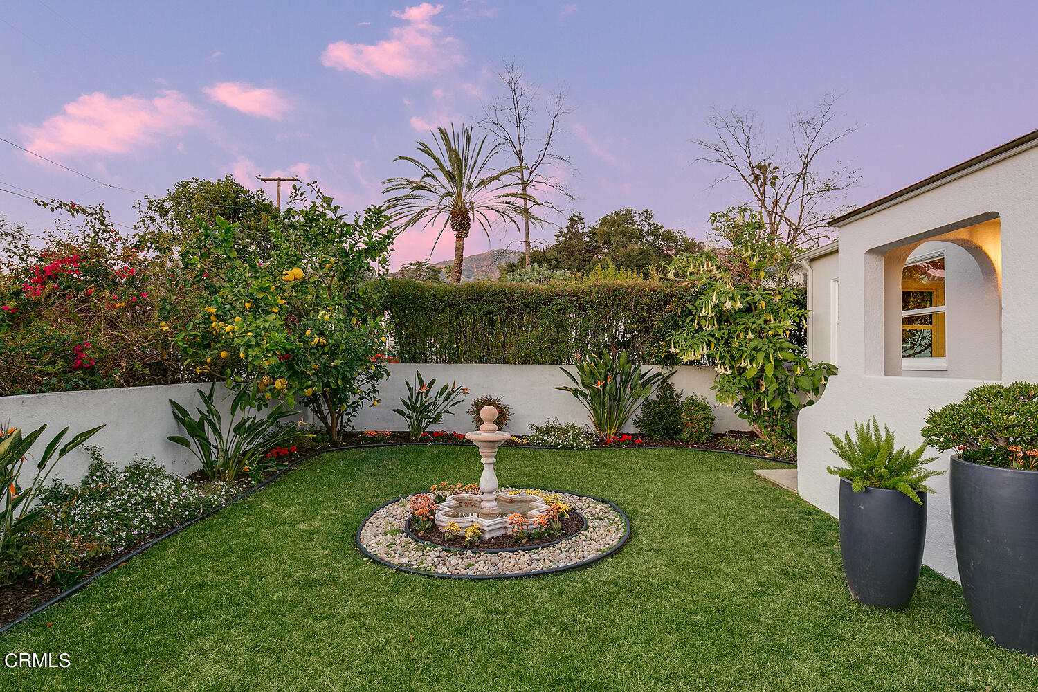 2040 North Madison Avenue Altadena, CA 91001 - Photo 45 of 53 a backyard of a house with a fountain and a garden