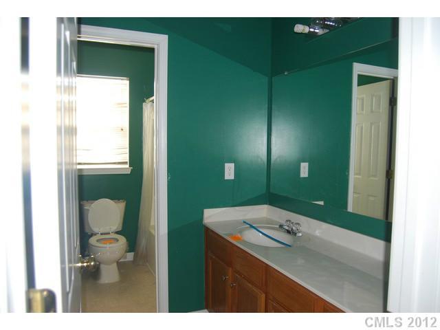 104 Austin Run Court Kannapolis, NC 28083 - Photo 13 of 16 a bathroom with a toilet sink and mirror
