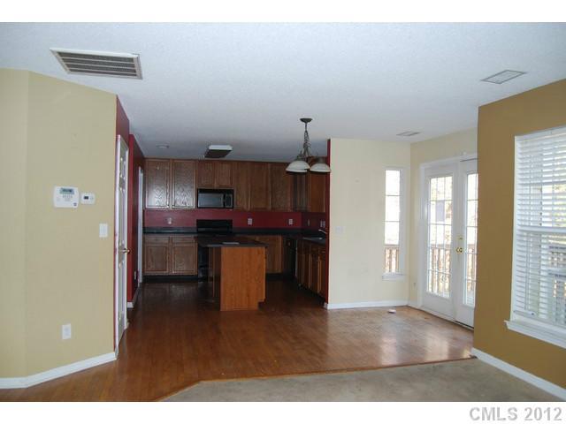 104 Austin Run Court Kannapolis, NC 28083 - Photo 3 of 16 a kitchen with a refrigerator and a sink