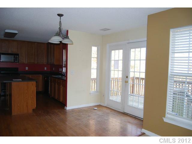 104 Austin Run Court Kannapolis, NC 28083 - Photo 5 of 16 a view of empty room with wooden floor and fan
