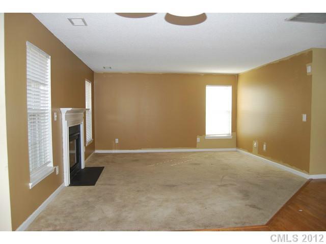 104 Austin Run Court Kannapolis, NC 28083 - Photo 7 of 16 a view of an empty room with a fireplace