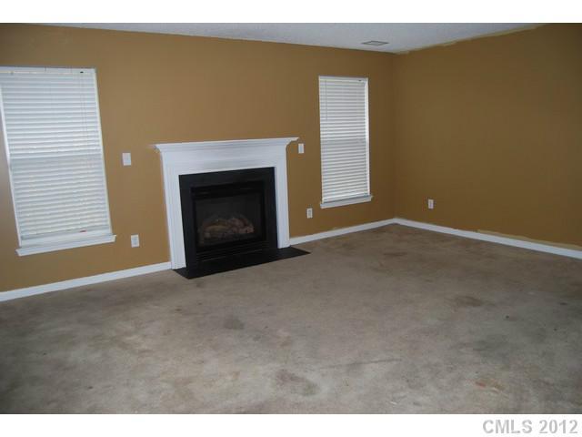 104 Austin Run Court Kannapolis, NC 28083 - Photo 8 of 16 a view of an empty room with a fireplace