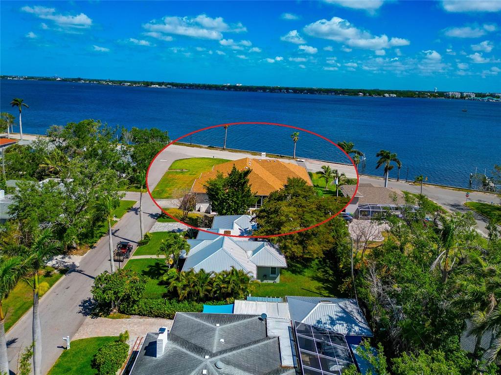 2305 Riverview Boulevard Bradenton, FL 34205 - Photo 19 of 71 an aerial view of a house with a lake view