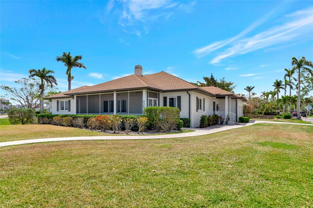 2305 Riverview Boulevard Bradenton, FL 34205 - Photo 4 of 71 a front view of a house with a yard