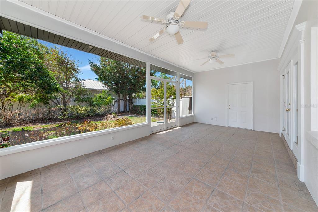 2305 Riverview Boulevard Bradenton, FL 34205 - Photo 52 of 71 a view of an empty room with a fireplace and a large window
