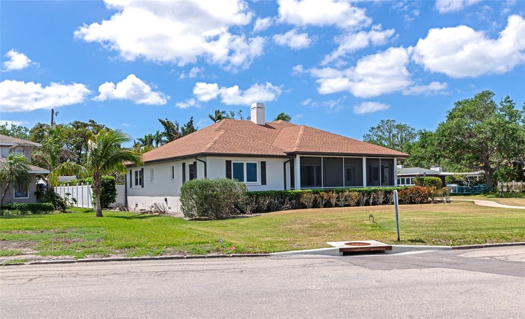2305 Riverview Boulevard Bradenton, FL 34205 - Photo 8 of 71 a view of a house with a big yard plants and large trees