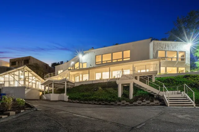 a front view of a building with a swimming pool