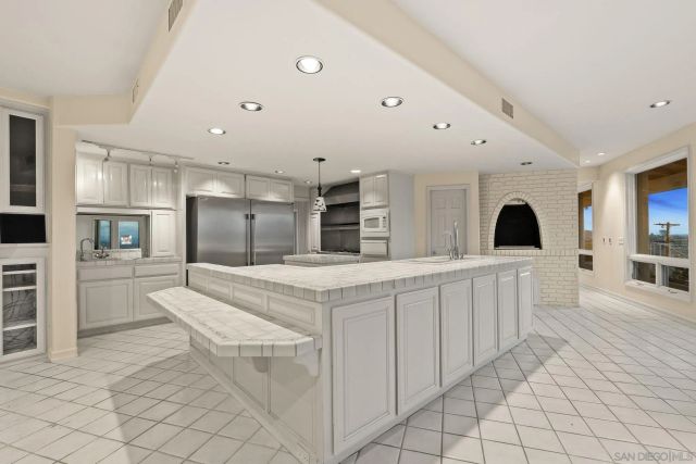 a bathroom with a sink and mirror with toilet