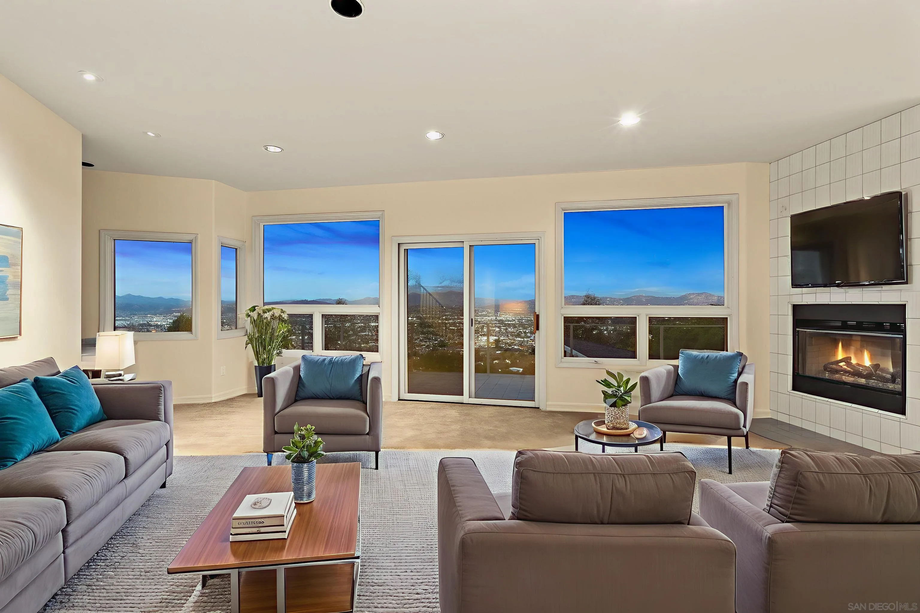 10595 Russell Road La Mesa, CA 91941 - Photo 25 of 40 a living room with furniture fireplace and a flat screen tv