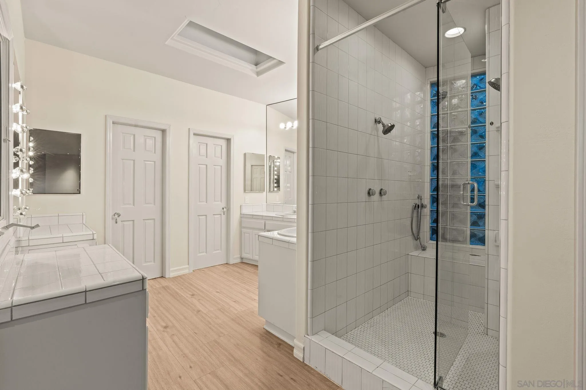 10595 Russell Road La Mesa, CA 91941 - Photo 28 of 40 a bathroom with a shower and a sink