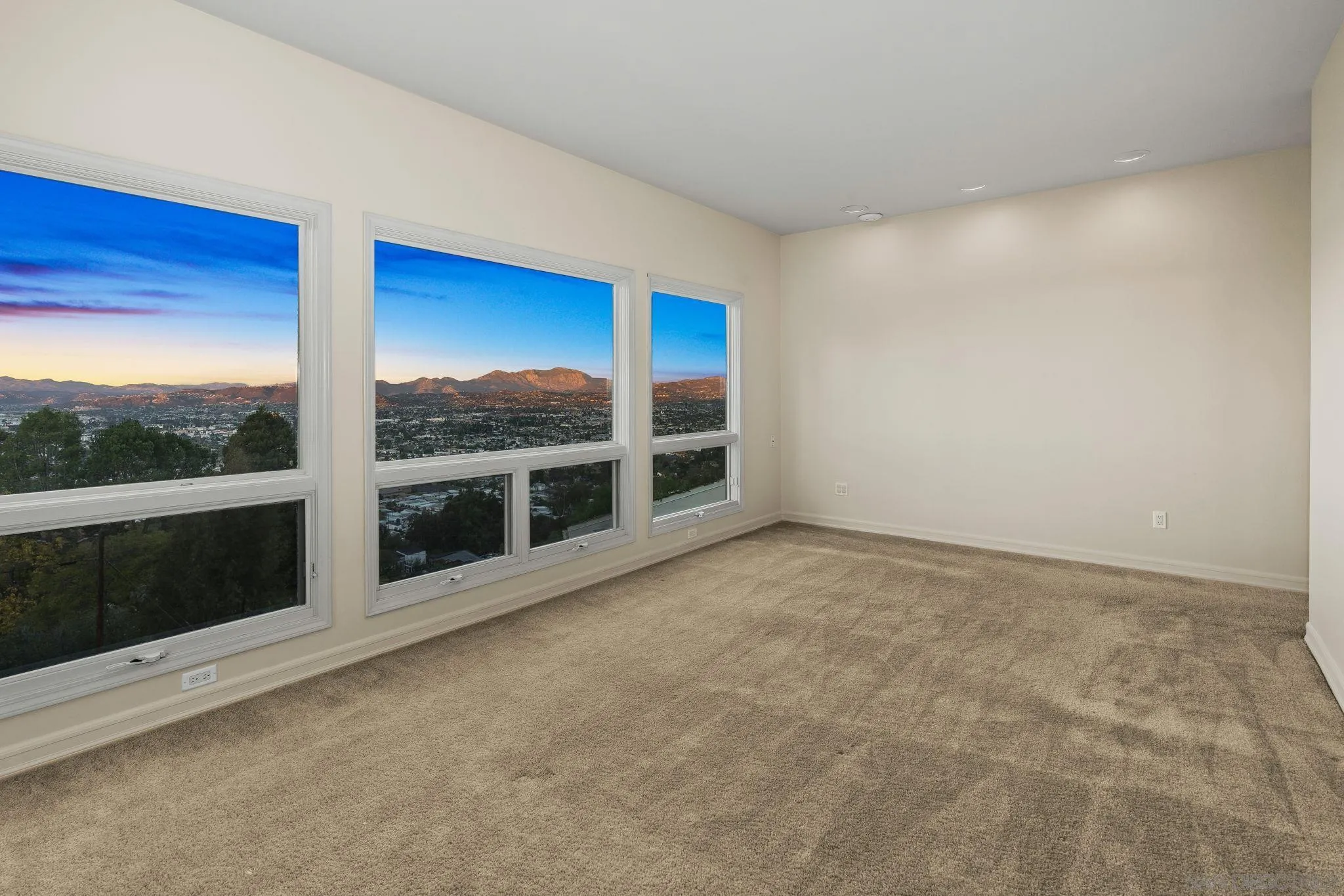 10595 Russell Road La Mesa, CA 91941 - Photo 32 of 40 a view of an empty room with a fireplace and large window