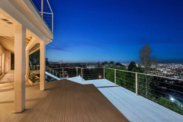 a view of a city and mountain from a balcony
