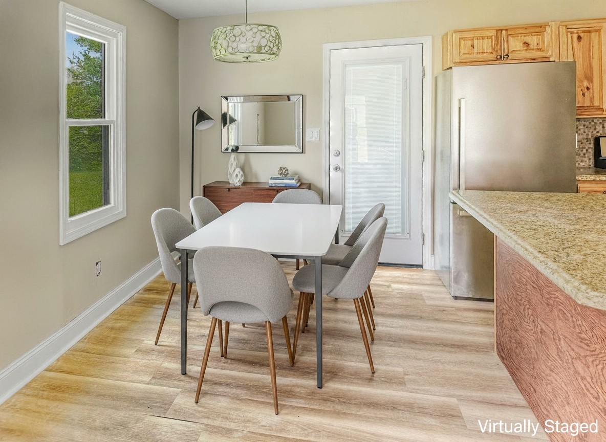 586 Foxfield Road Hopkinsville, KY 42240 - Photo 4 of 16 a view of a dining room with furniture window and wooden floor