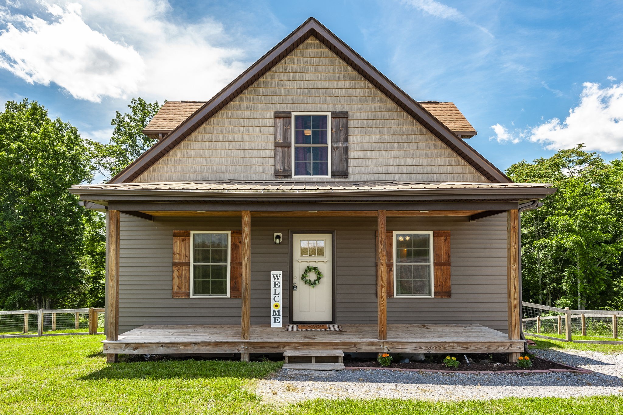 742 Kirbytown Road Lafayette, TN 37083 - Photo 1 of 34 a front view of a house with a yard