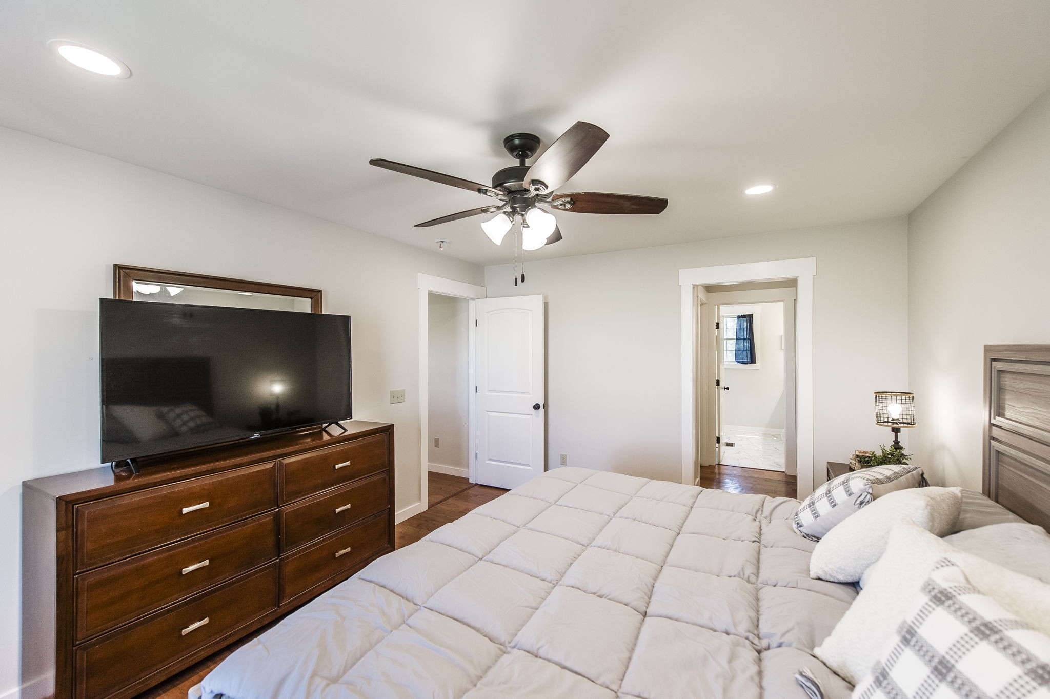 742 Kirbytown Road Lafayette, TN 37083 - Photo 16 of 34 a bedroom with a bed and a flat screen tv