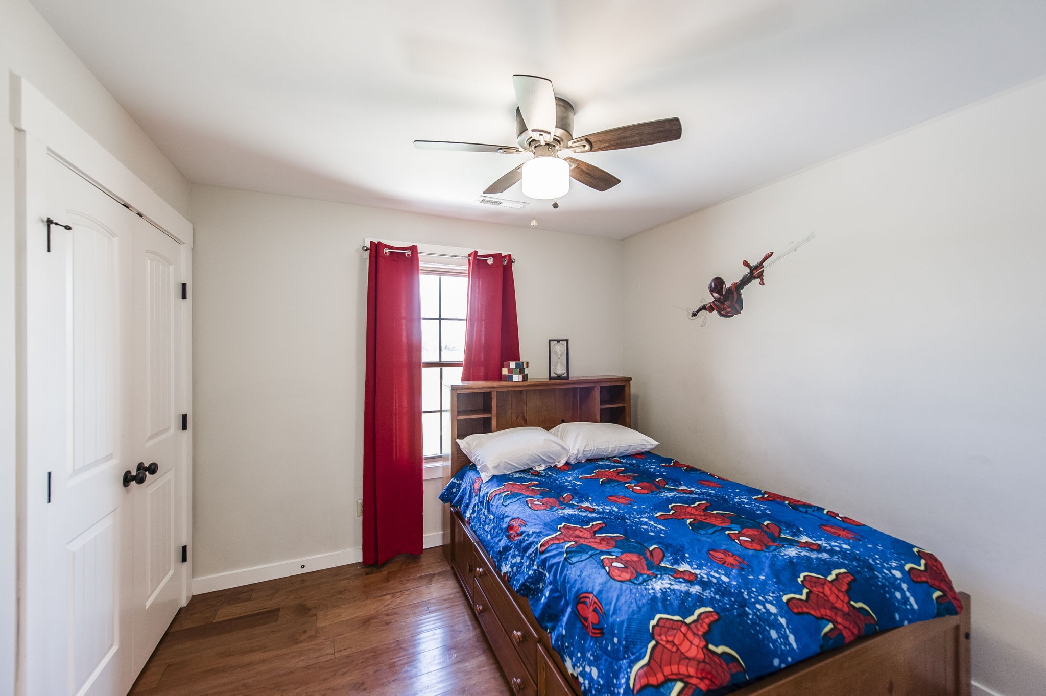 742 Kirbytown Road Lafayette, TN 37083 - Photo 25 of 34 a bedroom with a bed and wooden floor