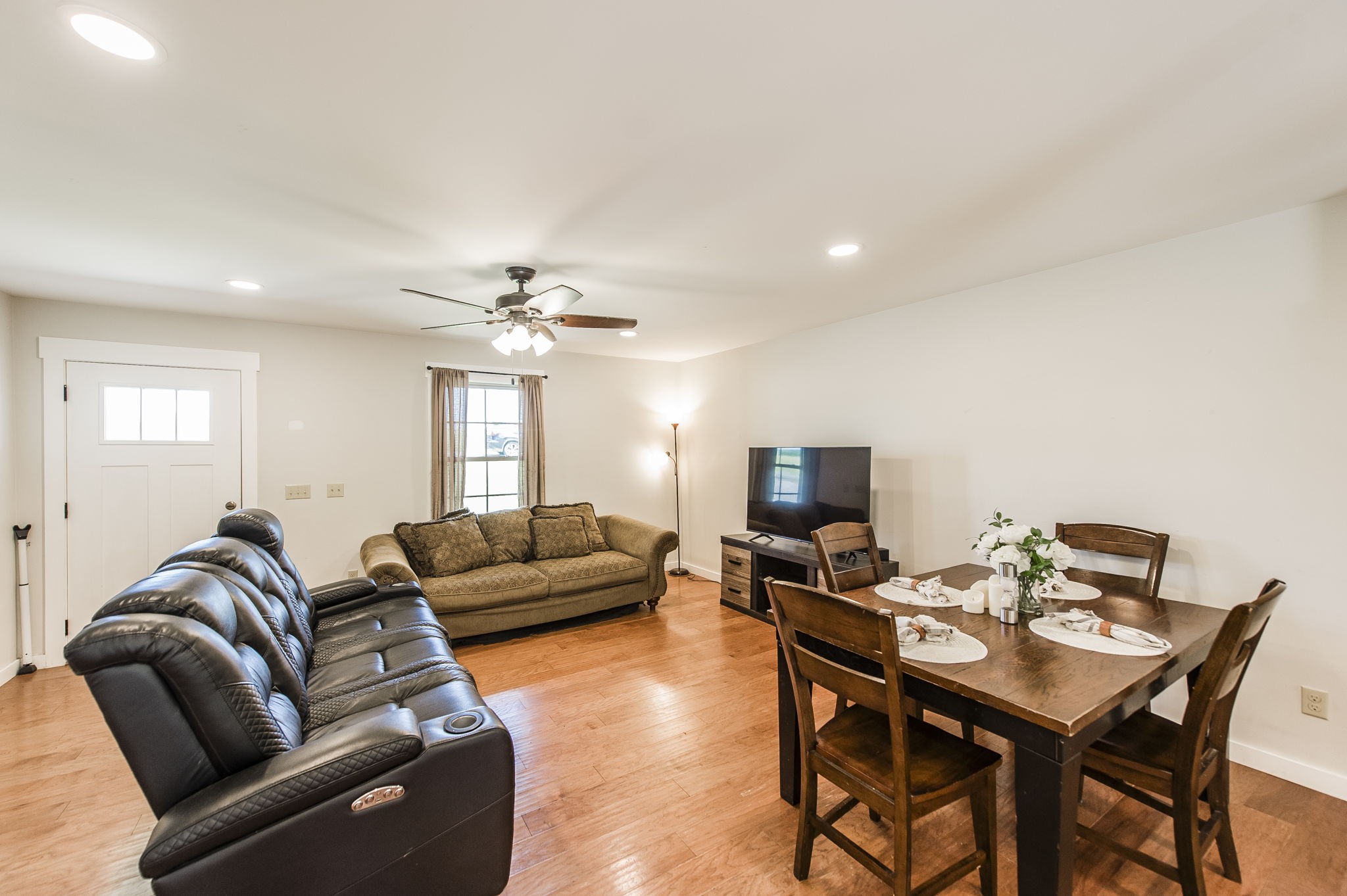 742 Kirbytown Road Lafayette, TN 37083 - Photo 7 of 34 a living room with furniture a ceiling fan and a window