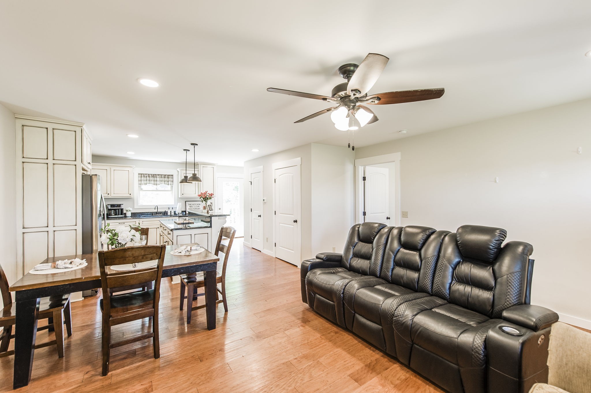 742 Kirbytown Road Lafayette, TN 37083 - Photo 8 of 34 a living room with furniture kitchen view and a chandelier