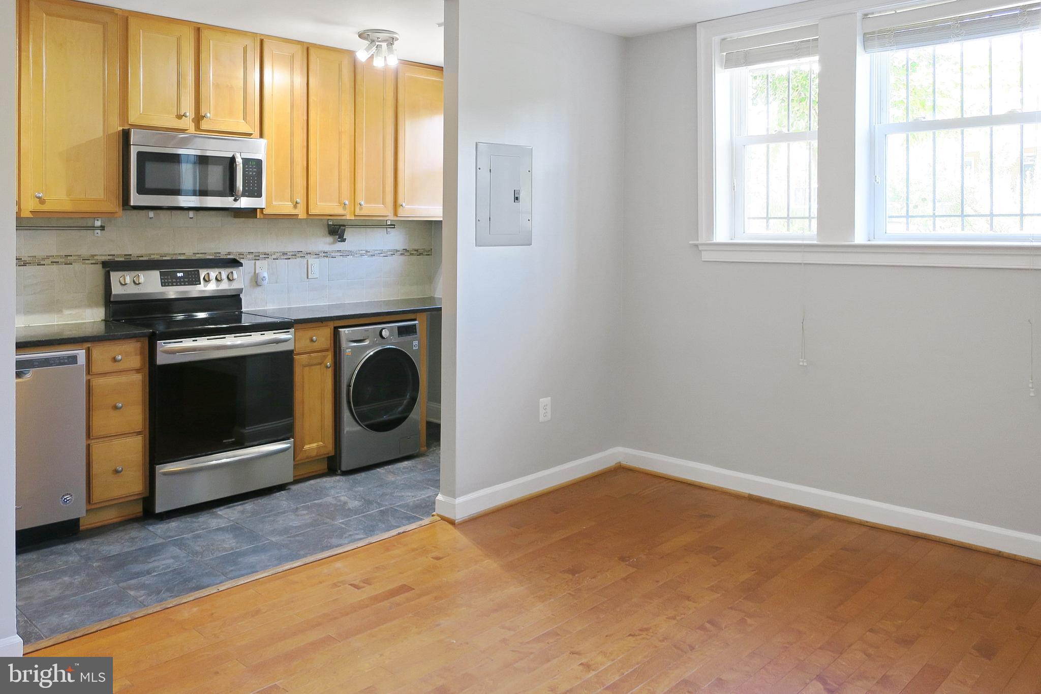 1815 A Street Southeast, Unit 101 Washington, DC 20003 - Photo 11 of 31 Kitchen and Living Room