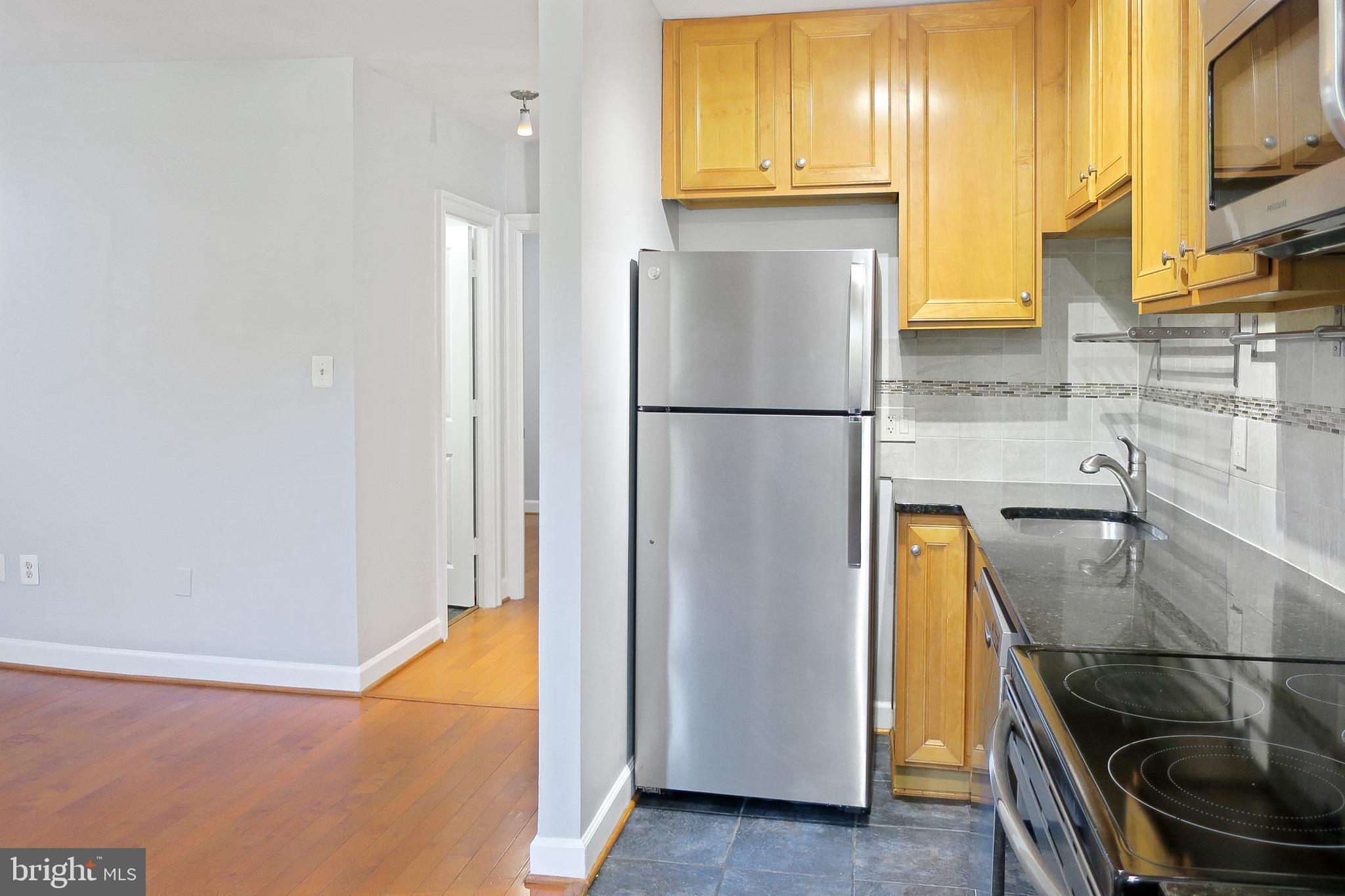 1815 A Street Southeast, Unit 101 Washington, DC 20003 - Photo 13 of 31 Kitchen into Living Room